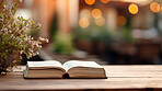 Religious book laying open on outdoor table. Religion and faith concept.