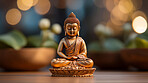 Close-up of bronze colour buddha on table. Copy space. Meditation, religion concept.