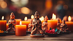 Close-up of buddha  statues and candles. Meditation, religion concept.