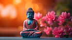 Close-up of  buddha with vibrant colour and flowers. Meditation, religion concept.