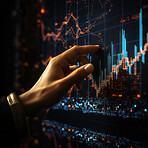 Hand touching screen with stock market graphs. Financial concept.