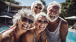 Senior friends in swimming pool. Active holiday fun, fitness and longevity