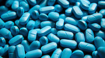 Blue pills background. Health supplement and science medicine research concept