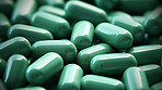 Green pills background. Health supplement and science medicine research concept