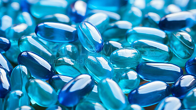 Blue gel pills background. Health supplement and science medicine research concept