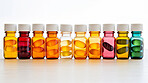 Colorful gel pills in glass containers. Health supplement and science medicine research concept