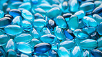 Blue gel pills background. Health supplement and science medicine research concept