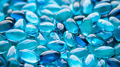 Blue gel pills background. Health supplement and science medicine research concept