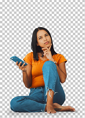Phone, thinking and social media with a woman in studio on a blue background, sitting on the floor. Mobile, contact or idea and an attractive young female posing with her finger on her chin