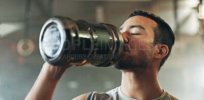 Happy asian man, fitness and drinking water after exercise, workout or training at indoor gym. Active and thirsty male person with mineral liquid for natural nutrition, sports diet or sustainability