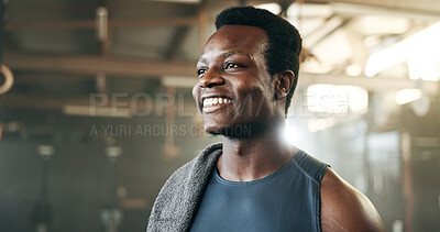 Smile, fitness and face of black man at a gym for training, exercise and athletics routine. Happy, mindset and African male personal trainer at sports studio for workout, progress and body challenge