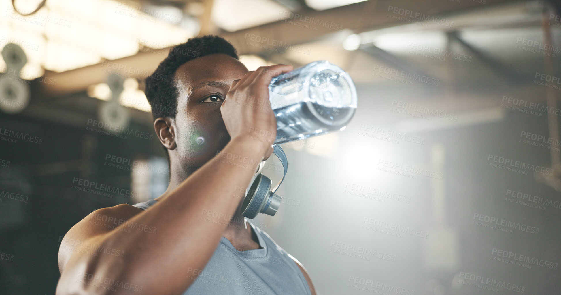 Buy stock photo Black man at gym, water bottle and relax to hydrate in muscle development, strong body and fitness. Commitment, motivation and bodybuilder with drink in workout challenge for health and wellness.