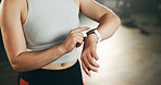 Smart watch, hands and woman in gym for fitness, exercise results and workout performance. Stopwatch, closeup and check information, timer and monitor healthy training progress, clock and sports gear