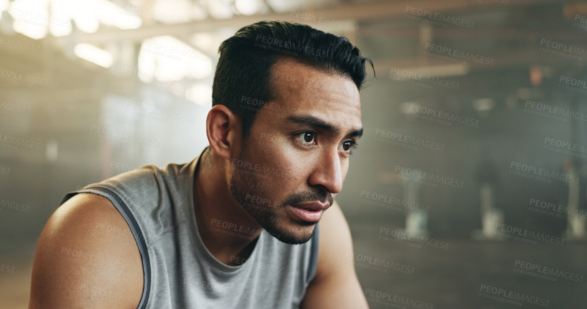 Buy stock photo Fitness, face and breathing with a tired man in the gym, resting after an intense workout. Exercise, sweating and fatigue with a young athlete in recovery from training for health or wellness