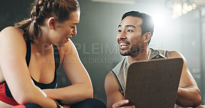 Man, woman and clipboard with talking in gym, sign up and planning for ideas, workout and smile with info. Personal trainer, paperwork and client for fitness, checklist and recruitment for wellness