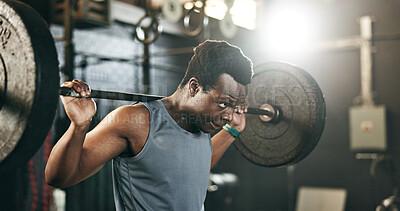 Buy stock photo Black man at gym, weight lifting and barbell for muscle building endurance, strong body or balance power in fitness. Commitment, motivation and bodybuilder in workout challenge in health and wellness