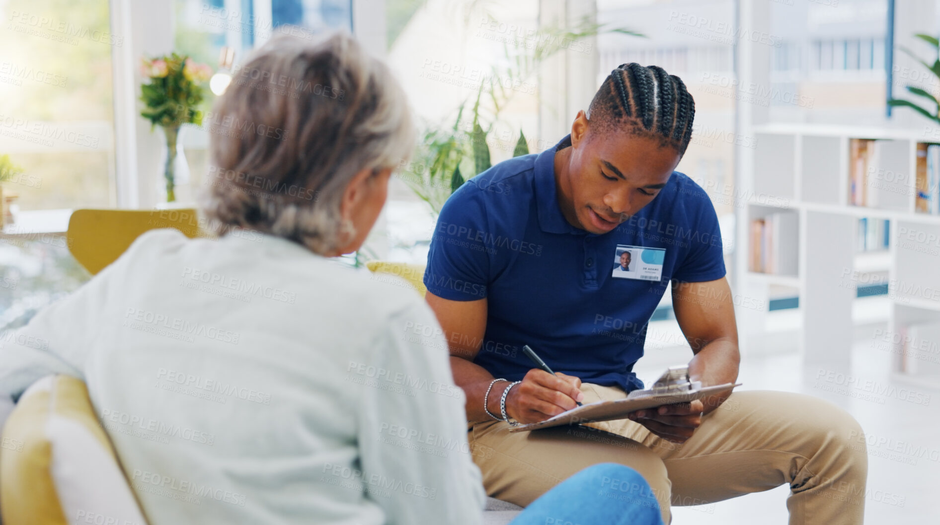 Buy stock photo Retirement, documents and a nurse talking to an old woman patient about healthcare in an assisted living facility. Medical, planning and communication with a black man consulting a senior in her home