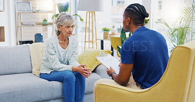 Retirement, clipboard and a nurse talking to an old woman patient about healthcare in an assisted living facility. Medical, planning and communication with a black man consulting a senior in her home