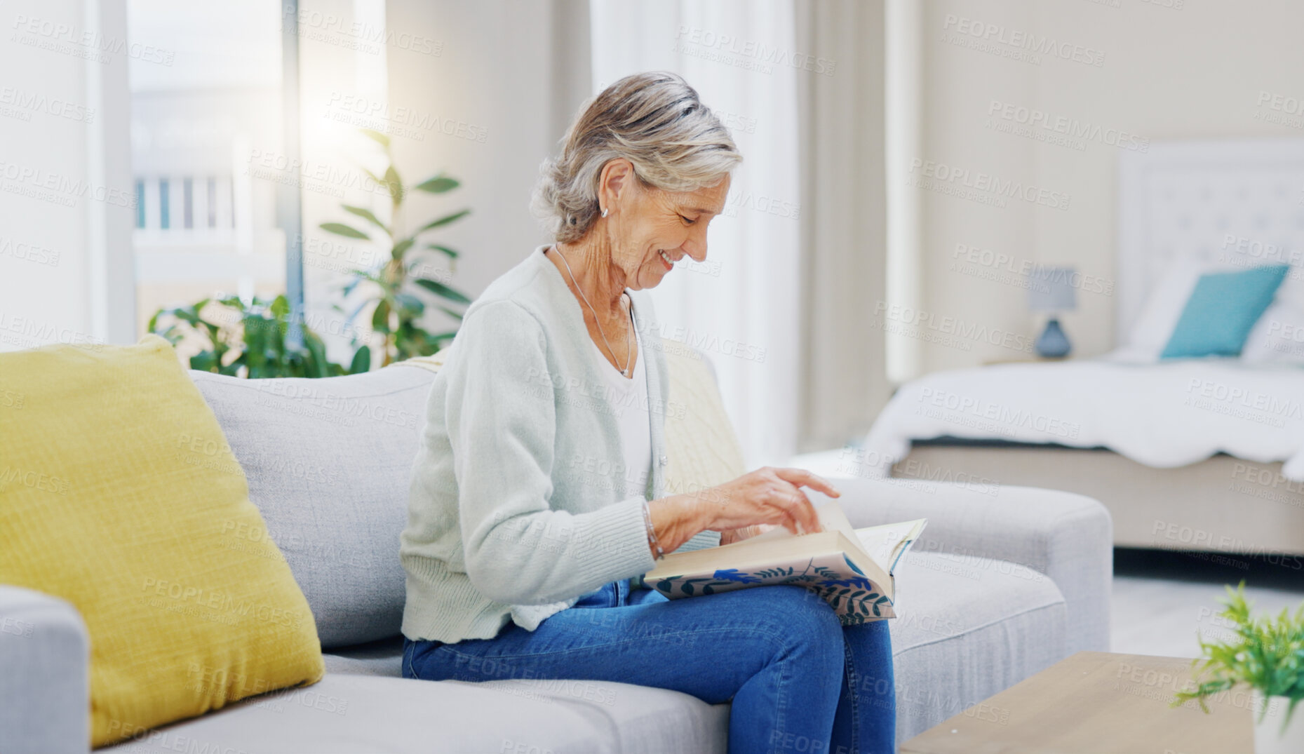 Buy stock photo Senior woman, book and reading to relax in living room for story, novel and knowledge. Elderly female person, books and focus in lounge for retirement break, literature and hobby on sofa at home