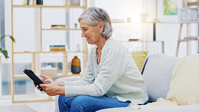 Relax, tablet and senior woman on sofa in living room scroll on social media, mobile app or the internet. Rest, online and elderly female person browsing on website with technology in lounge at home.