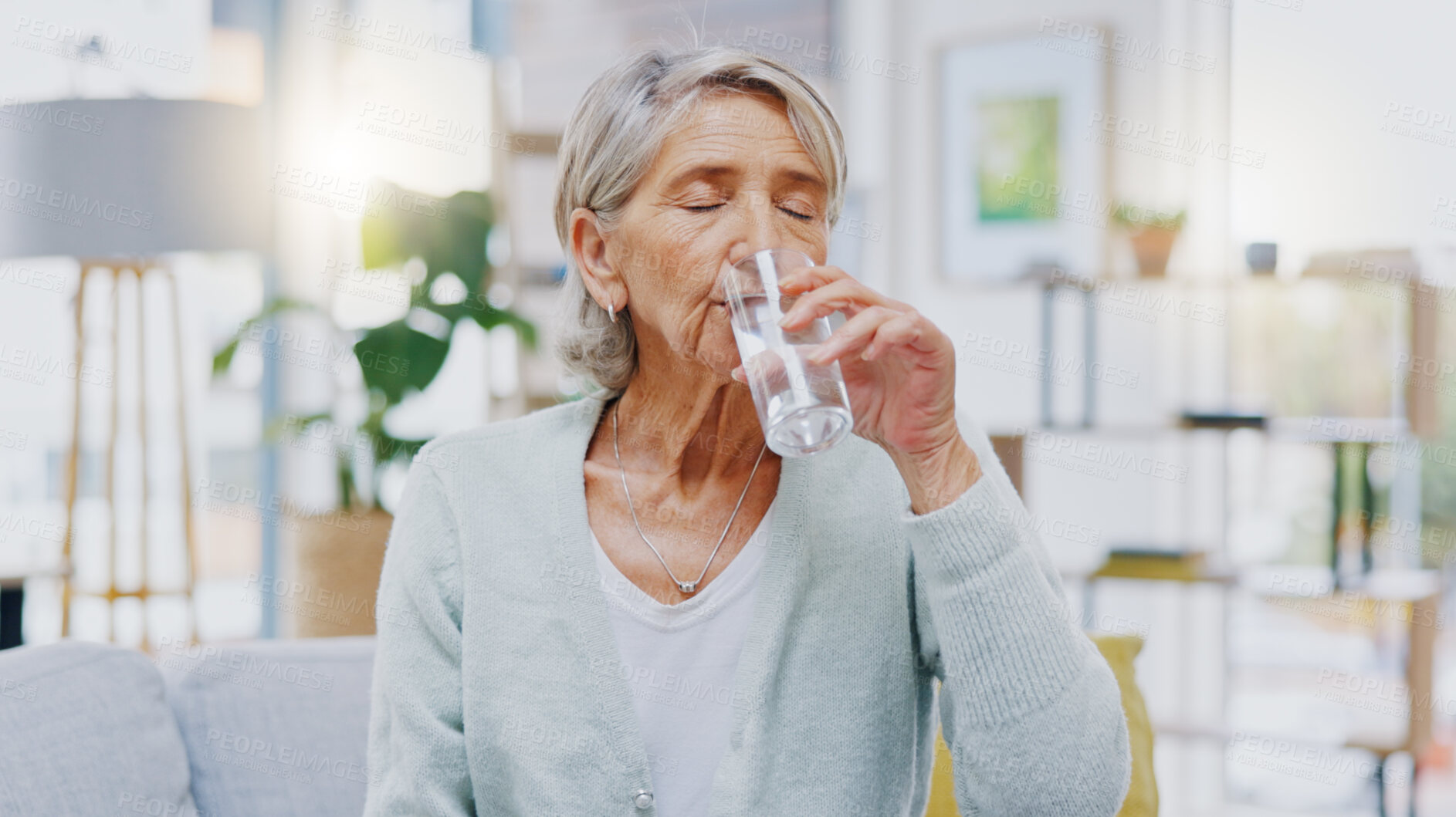 Buy stock photo Wellness, home or healthy old woman drinking water for healthcare or natural vitamins in a house. Retirement, elderly relaxing or thirsty senior person refreshing with liquid for energy or hydration