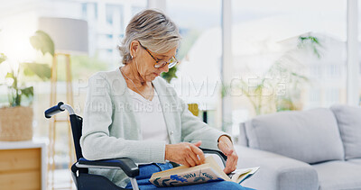 Senior woman, book and reading to relax in living room for story, novel and knowledge. Elderly female in wheelchair, enjoying books and focus in lounge for retirement break, literature and hobby at retirement care