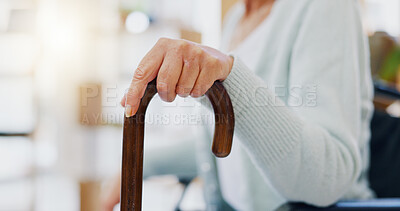 Hand, walking stick and closeup for woman in nursing home, living room or hospital for mobility support. Cane, crutch or rehabilitation for disability, stroke or injury for elderly lady with problem