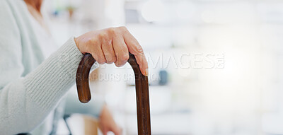 Hand, walking stick and closeup for woman in living room, nursing home or hospital for mobility support. Cane, crutch or rehabilitation for disability, stroke or injury for elderly lady with problem