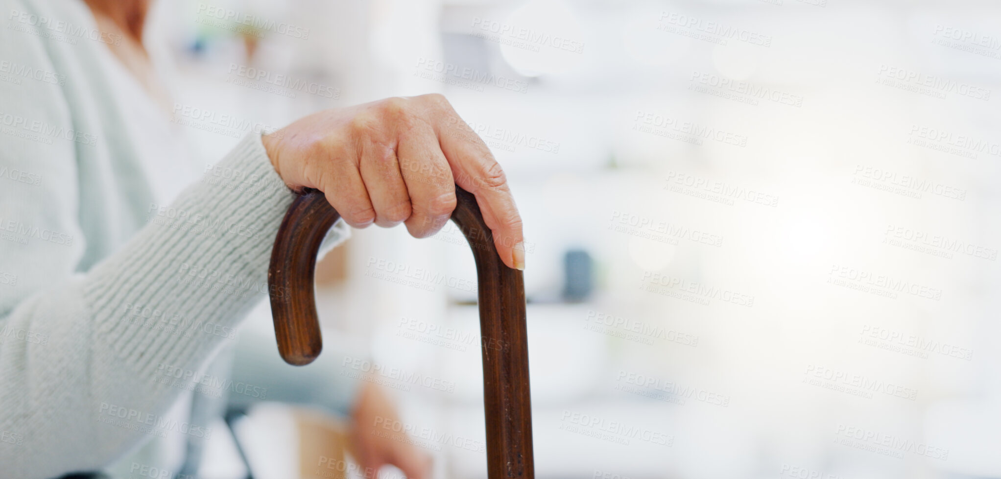 Buy stock photo Hand, walking stick and closeup for woman in living room, nursing home or hospital for mobility support. Cane, crutch or rehabilitation for disability, stroke or injury for elderly lady with problem