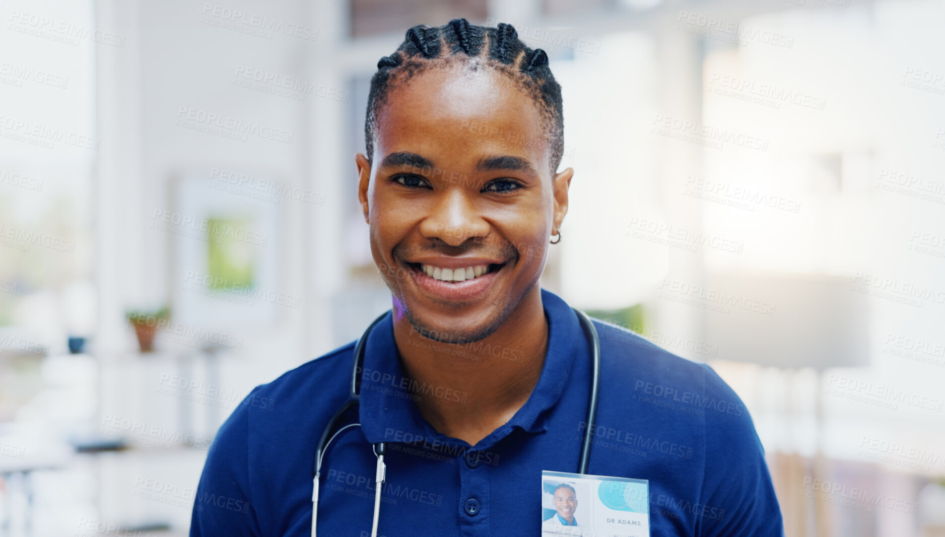 Buy stock photo Black man, doctor and smile on face in clinic for healthcare services, excited or happy for job. African medic, male nurse and happiness in portrait for wellness service, medical career or workplace