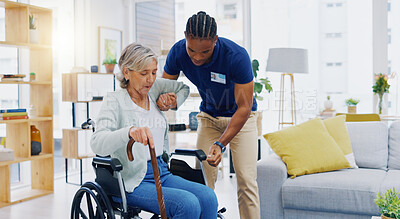 Help, home care and a woman with a caregiver and a wheelchair for disability, support and consulting. Happy, talking and a black man or male nurse helping a senior patient into a chair for nursing