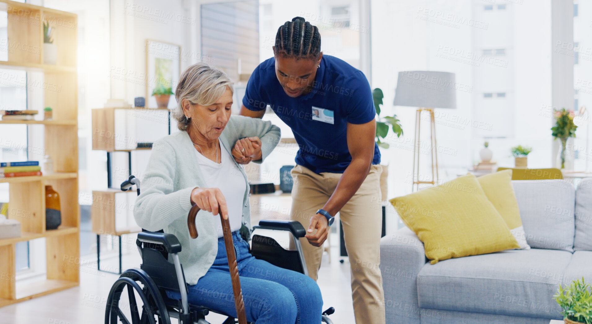 Buy stock photo Help, home care and a woman with a caregiver and a wheelchair for disability, support and consulting. Happy, talking and a black man or male nurse helping a senior patient into a chair for nursing