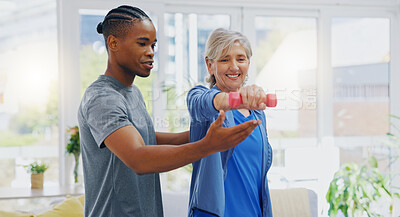 Elderly woman, dumbbells and rehabilitation therapist for exercise in a nursing home. Happy senior patient with physiotherapist man or nurse for healing, health and physiotherapy for muscle and body
