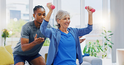 Rehabilitation, strong and woman with a physiotherapist for exercise, strength training and support. Help, fitness and a senior patient lifting dumbbells with black man in physiotherapy for recovery