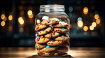 Chocolate chip cookies in glass jar. Fresh homemade sweet snack.