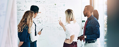 Buy stock photo Cropped shot of a group of businesspeople working together in the office