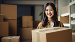 Young woman carrying large box during a move to new home or package delivery