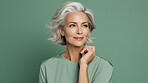 Radiant mature senior model woman with grey hair laughing and smiling for spa and dental