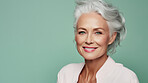 Radiant mature senior model woman with grey hair laughing and smiling for spa and dental