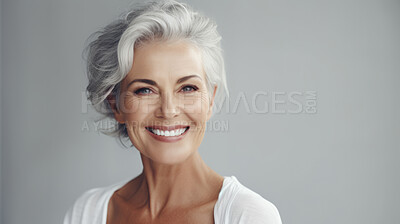 Radiant mature senior model woman with grey hair laughing and smiling for spa and dental
