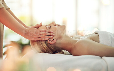 Buy stock photo Cropped shot of a young woman enjoying a head massage at a spa