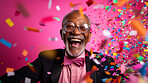Happy laughing man with falling confetti. Birthday, New Year, fun celebration party