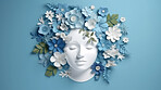 World mental health awareness day. Paper cutout woman head  and flowers blue background