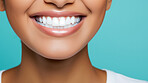 Closeup of woman with a beautiful smile for dental care against a blue background