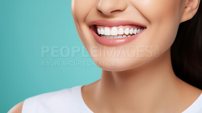 Closeup of woman with a beautiful smile for dental care against a blue background