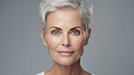 Radiant mature senior model woman smiling for spa beauty and skincare in studio