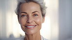 Radiant mature senior model woman smiling for spa beauty and skincare