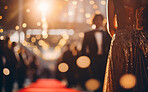 Woman in golden dress on celebrity red carpet. Festive award ceremony event