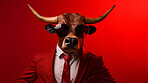 Bull wearing glasses and suit for office style or business against a red background