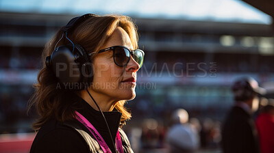 Buy stock photo Motor race track supervisor with headphones. Professional safety information manager